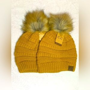 2 beanies with a puff